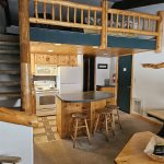Loft access, living area, and kitchen
